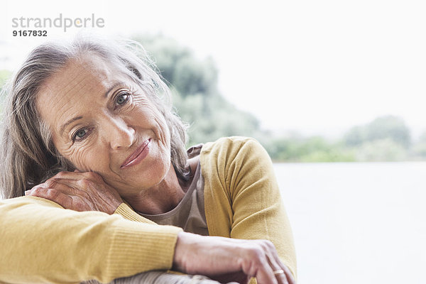 Woman smiling on sofa