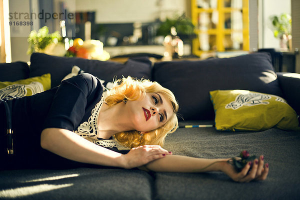 Caucasian woman relaxing on sofa