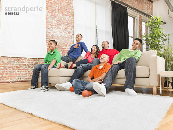 Family relaxing together in living room