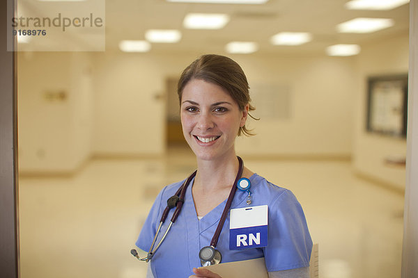 Caucasian nurse smiling in hospital