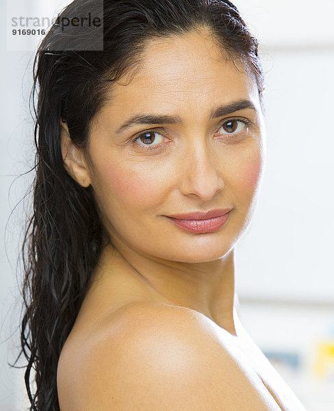 Mixed race woman with wet hair