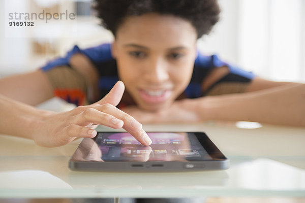 Black woman using digital tablet