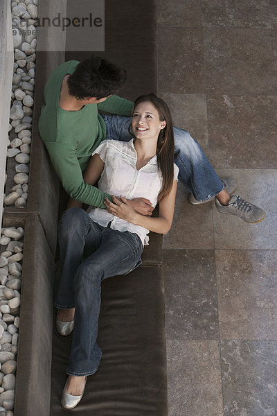 Caucasian couple relaxing on sofa