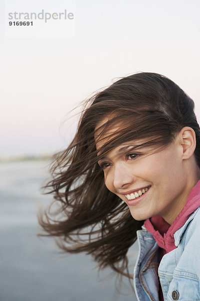 Caucasian woman's hair blowing in wind