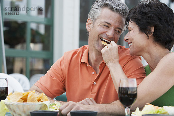 Caucasian couple eating together