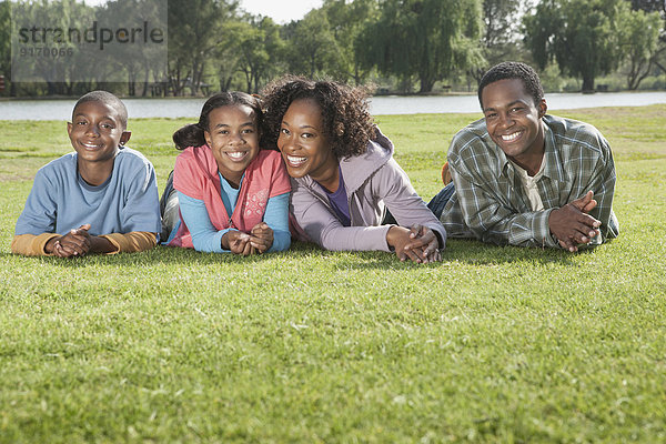 Family relaxing together in grass