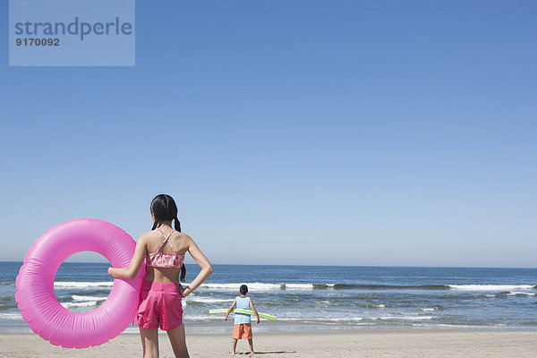 Hispanic children playing on beach