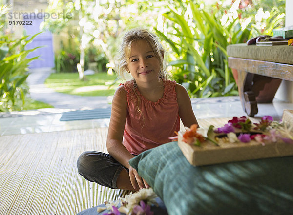 Caucasian girl sitting by shrine