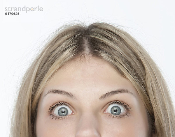 Close up of woman's eyes wide open