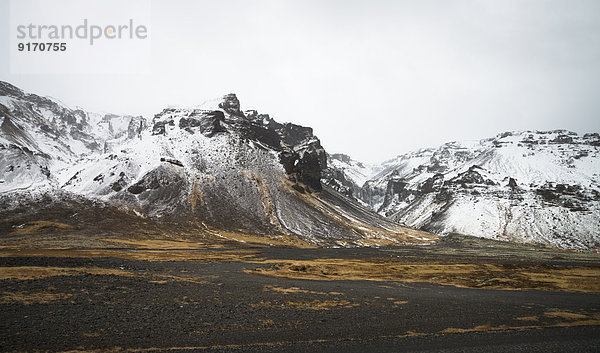 Iceland  Snow on mountains in Pjodvegur