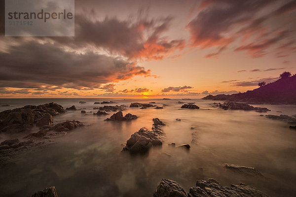 Australia  New South Wales  Tweed Shire  sunrise at the rocky shore of Hastings Point