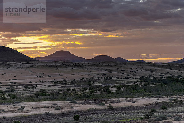 Africa  Namibia  Damaraland  view to grassland and volcanos by sunset