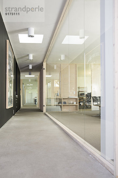 Empty corridor and workspace of modern office