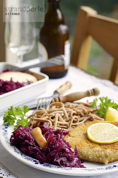Tempeh schnitzel with red cabbage and wheat spaetzle
