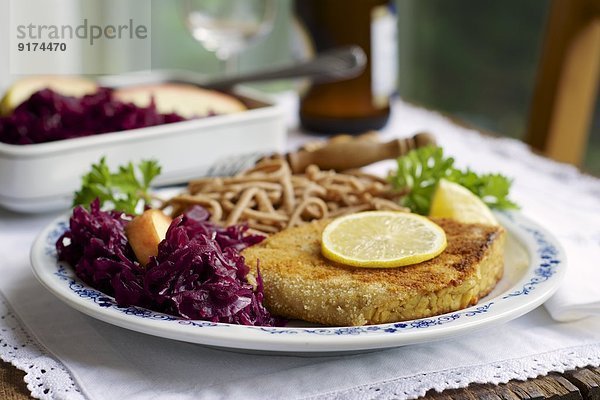 Tempeh schnitzel with red cabbage and wheat spaetzle