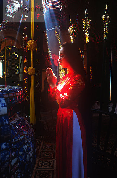 Woman Praying  Tet New Year  Saigon  Vietnam.MODEL RELEASED
