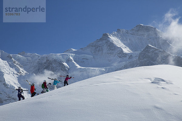 Frau Berg Winter Mann schnitzen Skisport Ski Berner Alpen Mönch Wintersport