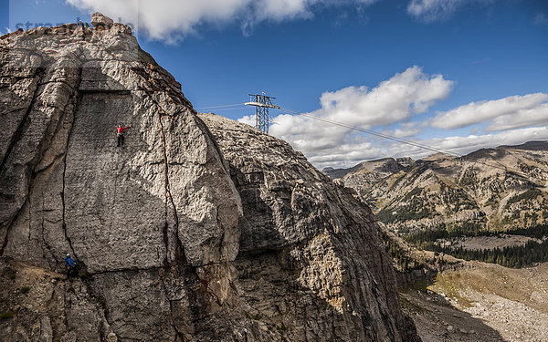 Bergsteiger Hintergrund Loch 2 Verkehrshütchen Leitkegel Seilbahn klettern Jackson Wyoming