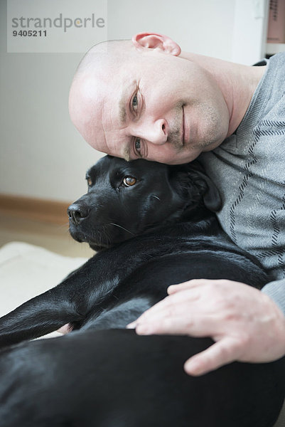 Portrait of man with his dog  smiling