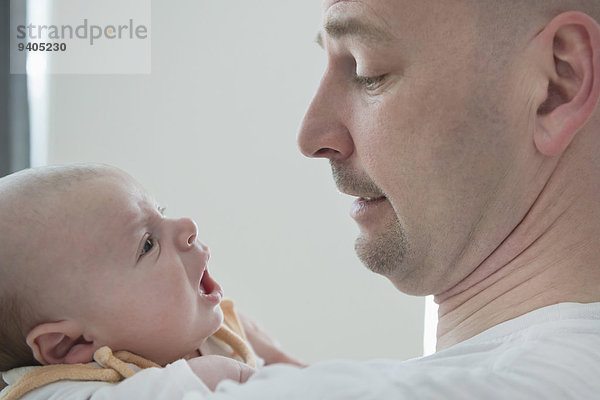 Father and baby boy communicate with each other  close up