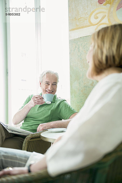 Couple drinking coffee  smiling