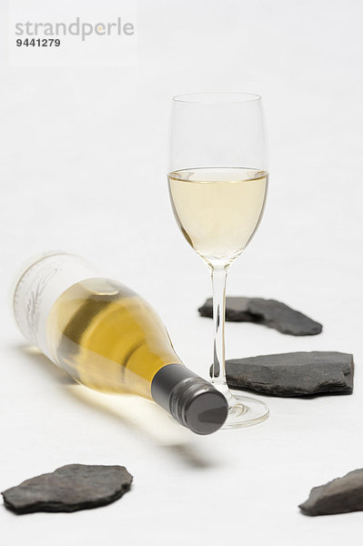 Bottle of white wine and wine glass