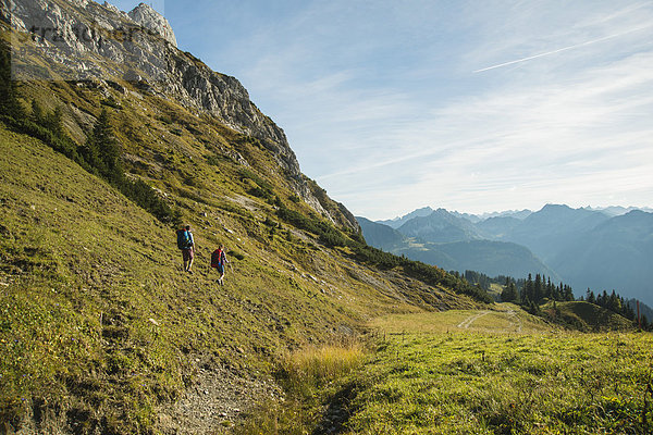 Austria  Tyrol  Tannheimer Tal  young couple hiking