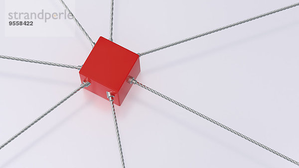 3D-Rendering des an Seilen befestigten roten Würfels