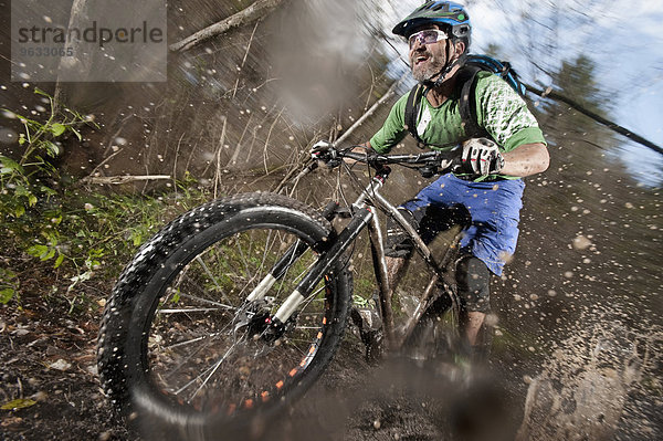 Mountain biker riding on a dirt road