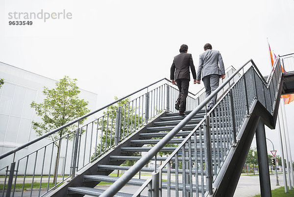 Businessmen ascent ladder of success job Teamwork