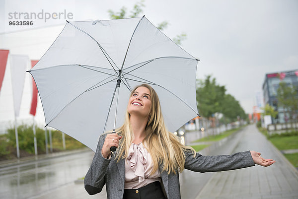 Woman anticipation storm umbrella protection