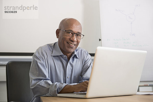 Portrait African man office laptop computer