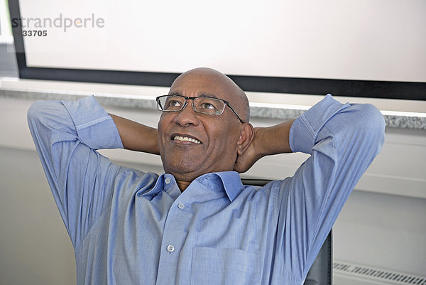 Man African relaxed office smiling happy relaxed
