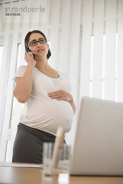Talking phone Home office pregnant woman