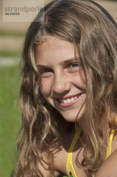 Portrait of a girl (12-13) in field  close-up