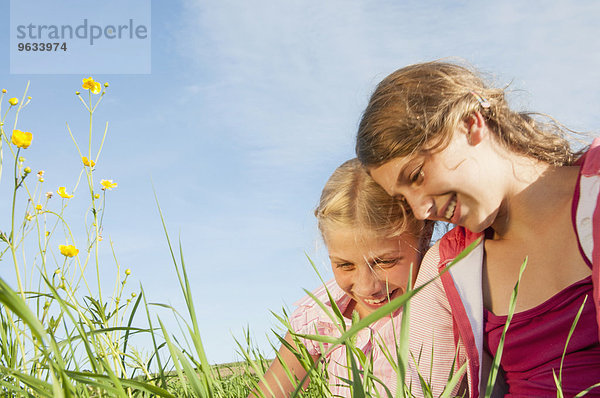 Portrait two girls field countryside happy