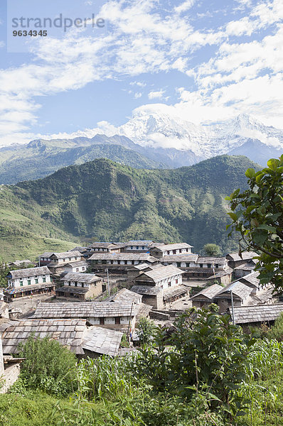 View of ghandruk village with mountain ranges in background