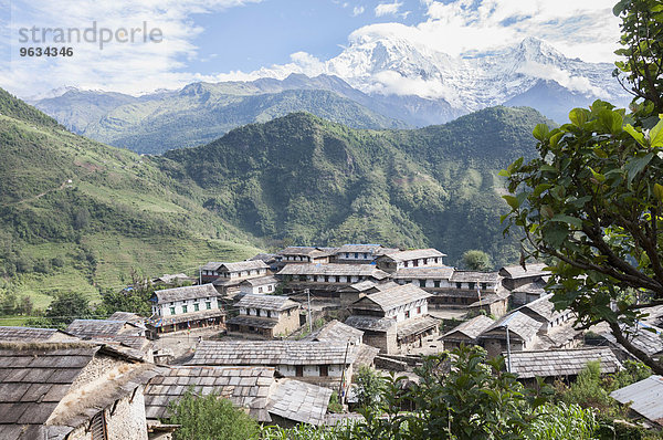 View of ghandruk village with mountain ranges in background