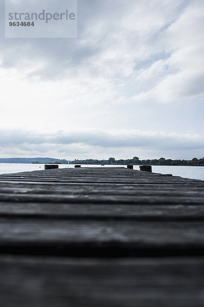 Landing stage wooden jetty lake water cloudy
