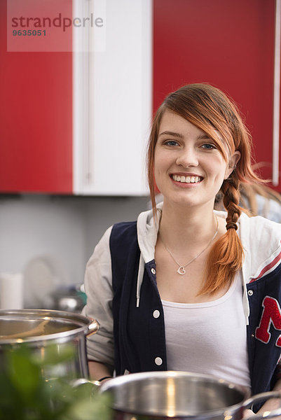 Young woman cooking in the kitchen