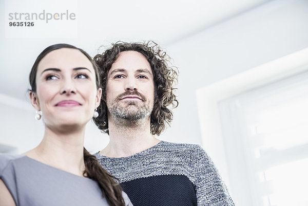 Close-up of two confident business executives in an office