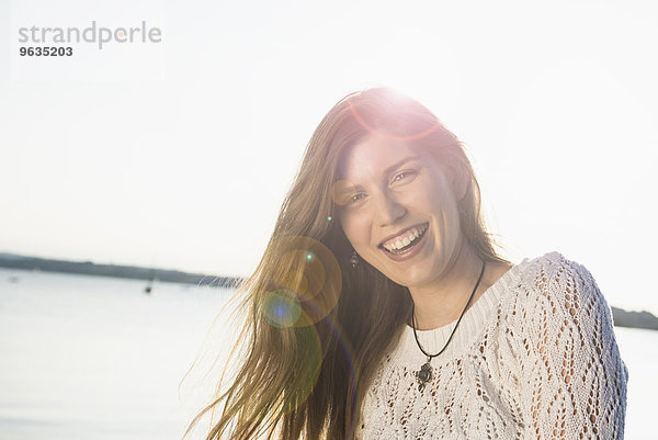 Smiling happy portrait pretty young woman sunset