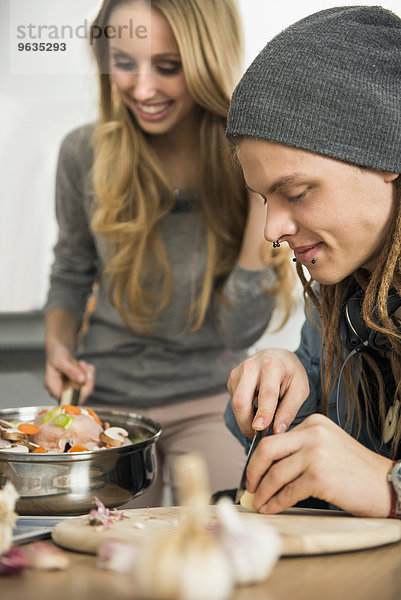 Couple preparing food in the kitchen