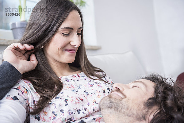 Caucasian couple relaxing in a living room