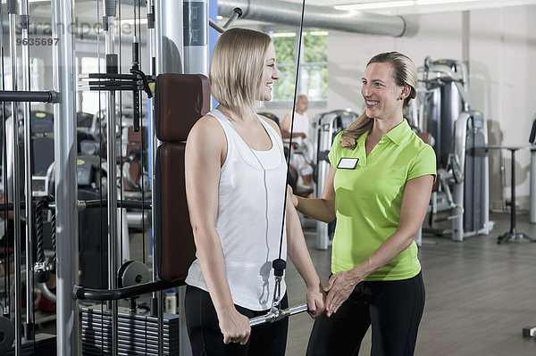 Woman fitness studio trainer sport assistance