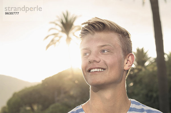 Sunset portrait young teenager smiling holiday