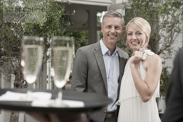 Attractive couple garden date Rendezvous Champagne