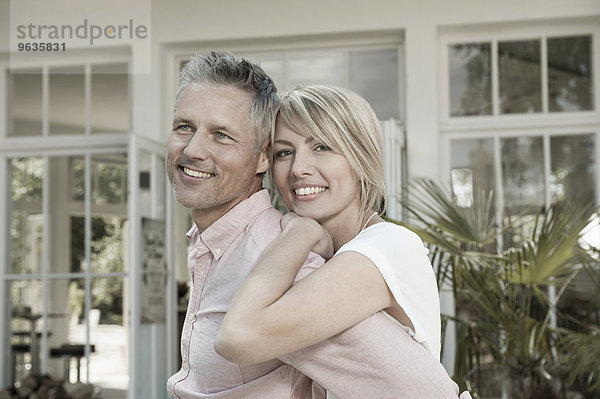 Couple married hugging garden portrait smiling