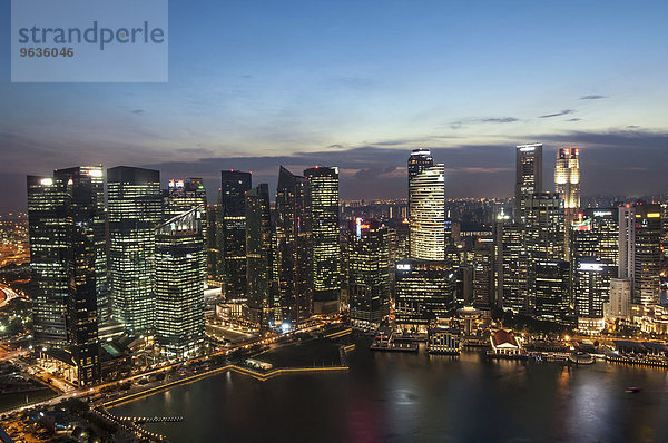 Skyscrapers lit up at night in a city