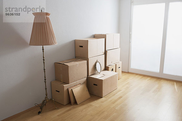 Stack of cardboard boxes in a room